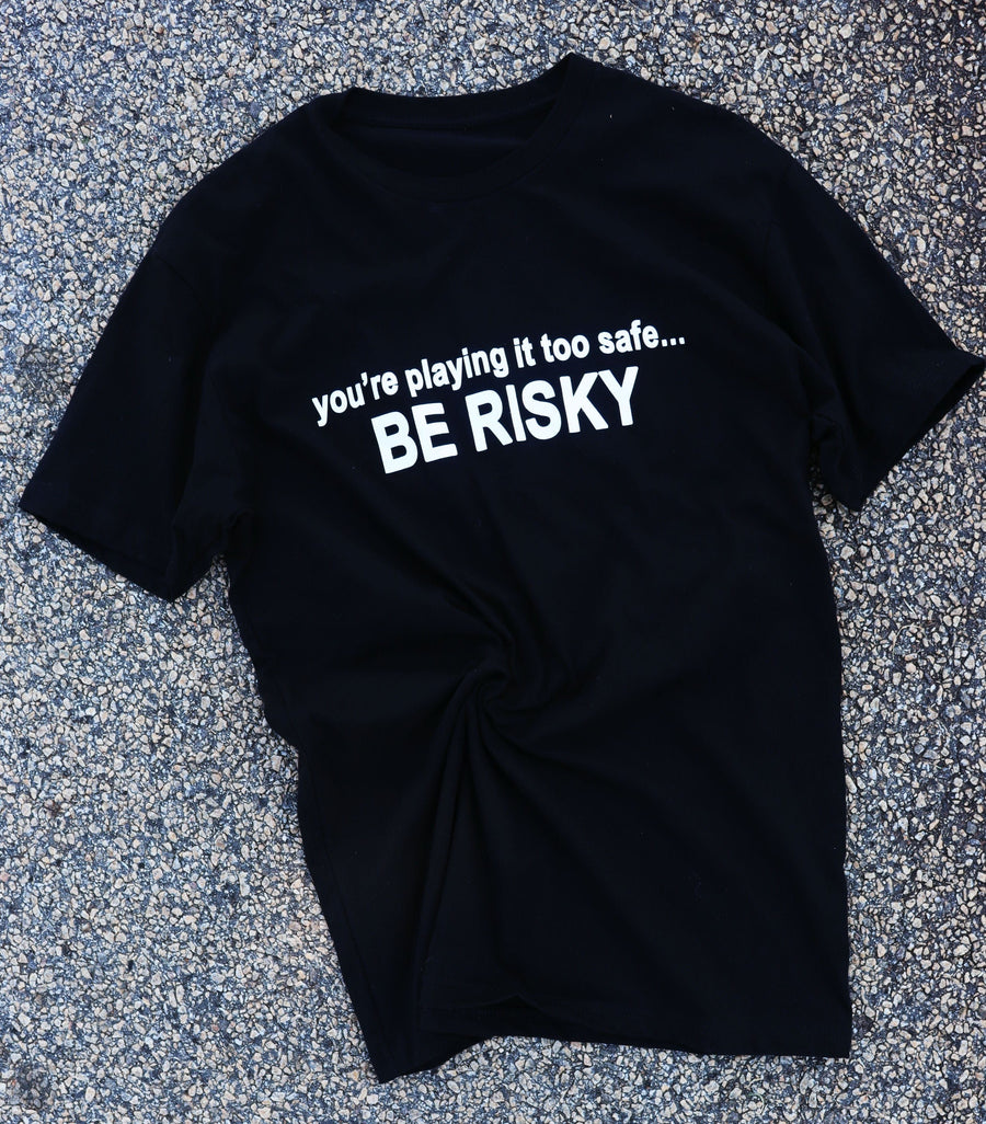 RISKY REWARDS “PLAYING IT TOO SAFE” COTTON TEE